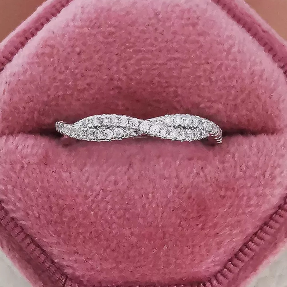 - Simple white gold twisted Diamond band ring